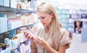 You woman looking at cosmetic products